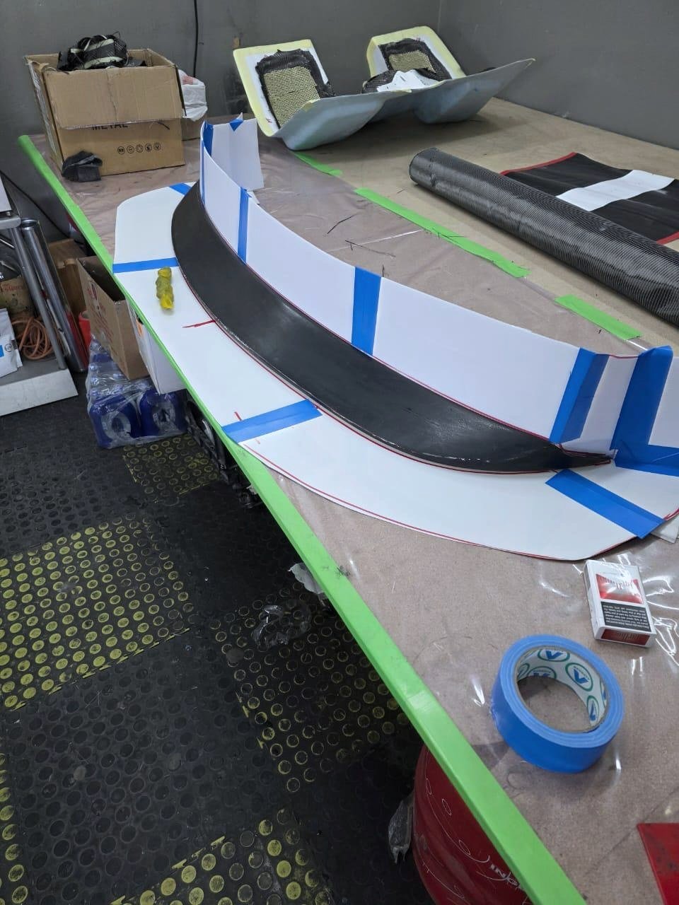 The master grille sealed and walled with tape, ready for the mould to be laid.