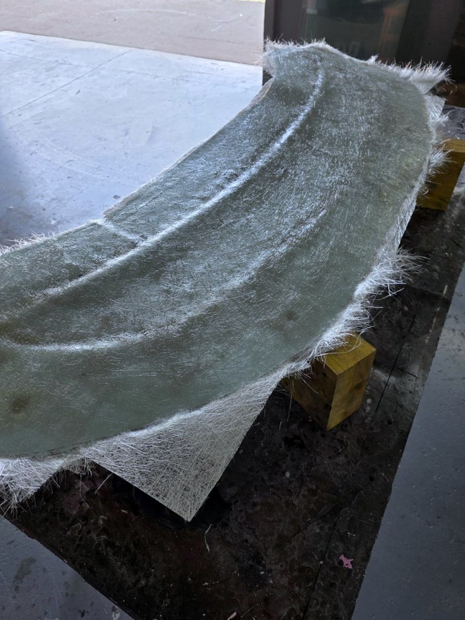 Glass fibre and resin laid over the master to build the mould.