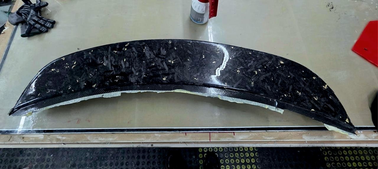 The finished, polished carbon grille on the bench before packing.